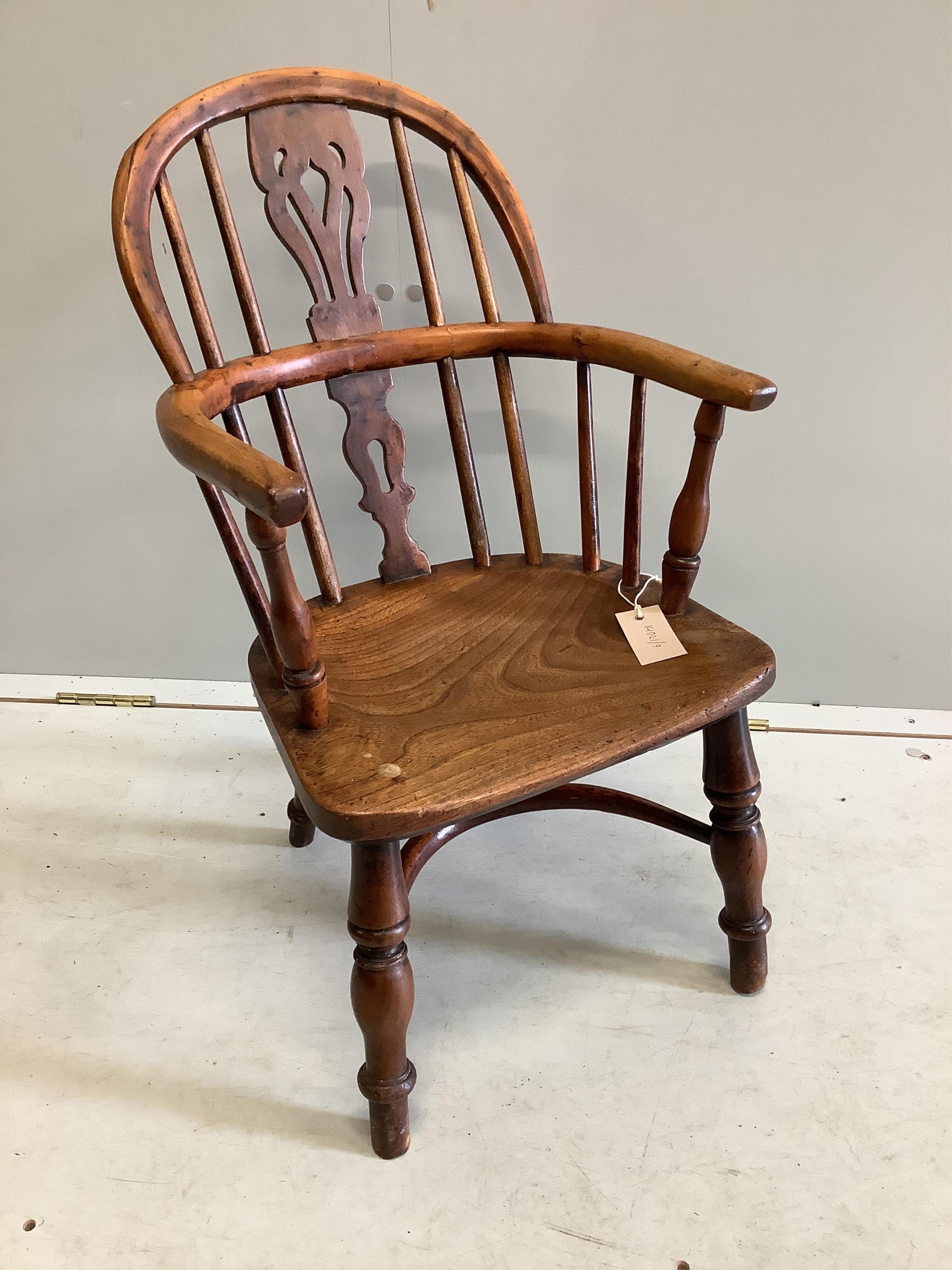 A 19th century yew and elm child's Windsor elbow chair, stamped 'Prior', width 38cm, depth 30cm, height 68cm